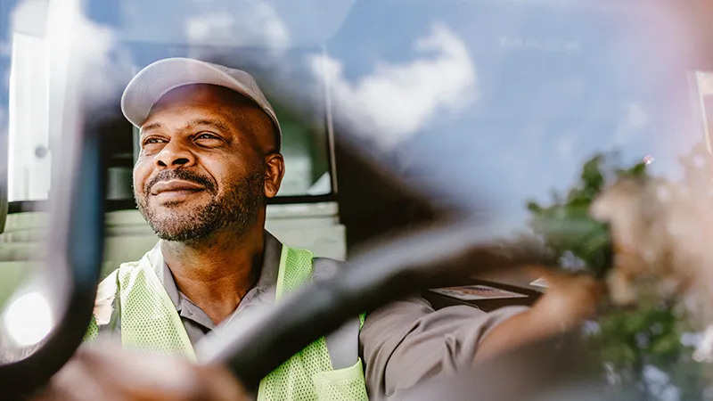 A driver in the cab of the Mack LR Electric